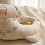 Close detail of the Marlowe feeding pillow fabric and whale print